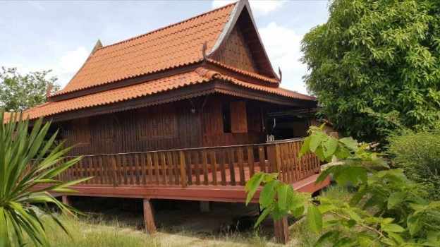 Thai style wooden house with garden in Surin city.